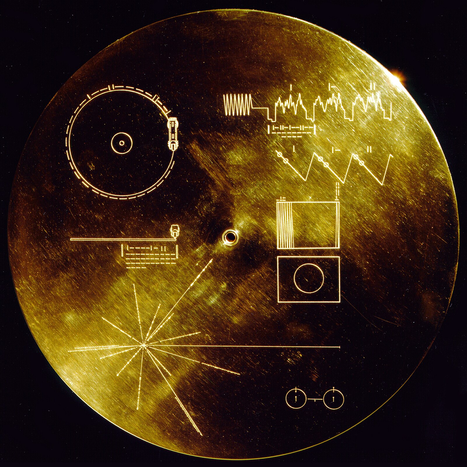 The Golden Record cover carried aboard the Voyager spacecraft, featuring a pulsar map, instructions for playback, and diagrams using the hydrogen atom as a universal unit of measurement.